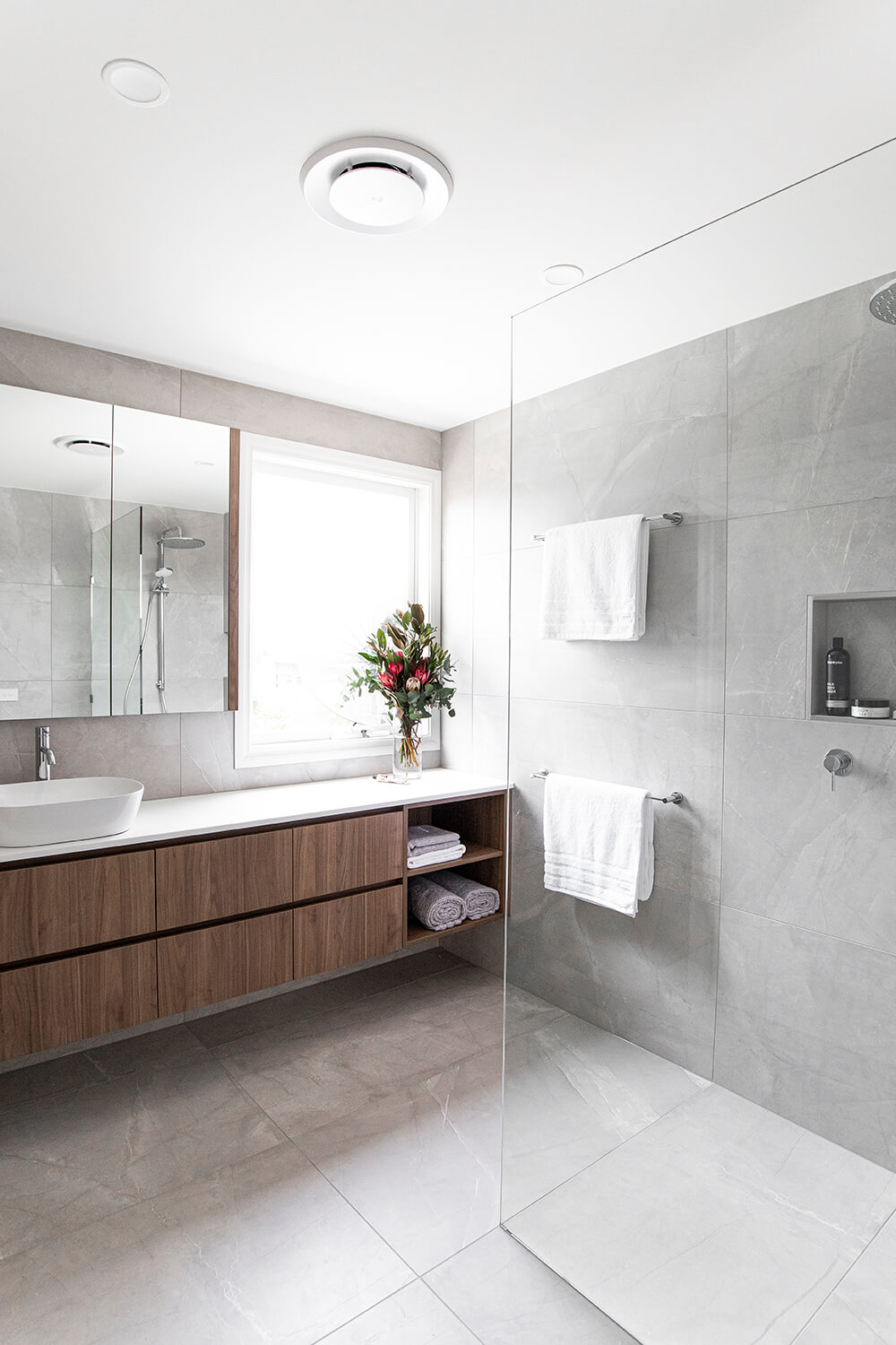 A custom designed bathroom featuring chrome fixtures. Designed and built by MJ Harris Group. #MJHxDundasSt