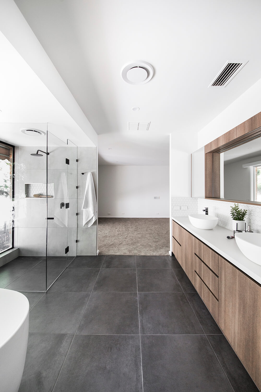A custom designed bathroom featuring custom joinery. Designed and built by MJ Harris Group. #MJHxWebstersRd