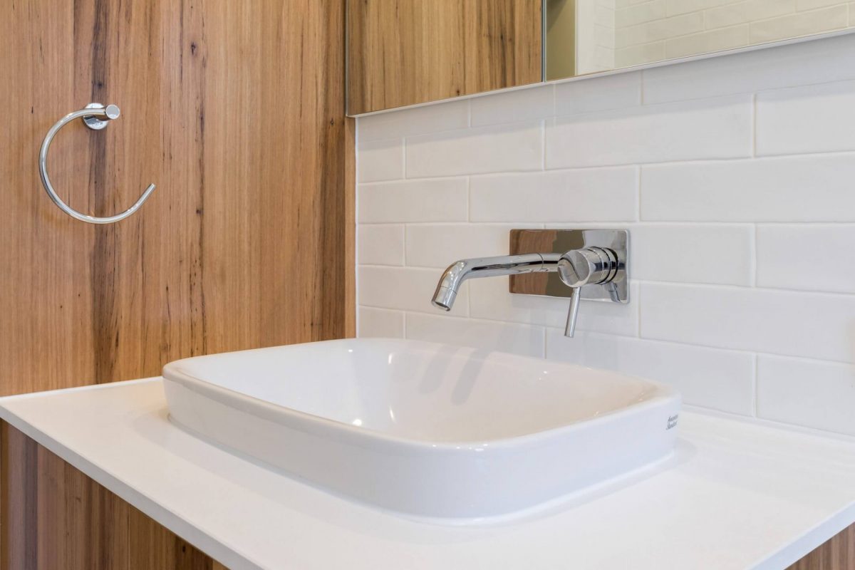 A custom designed bathroom featuring a recycled timber vanity. Designed and built by MJ Harris Group.