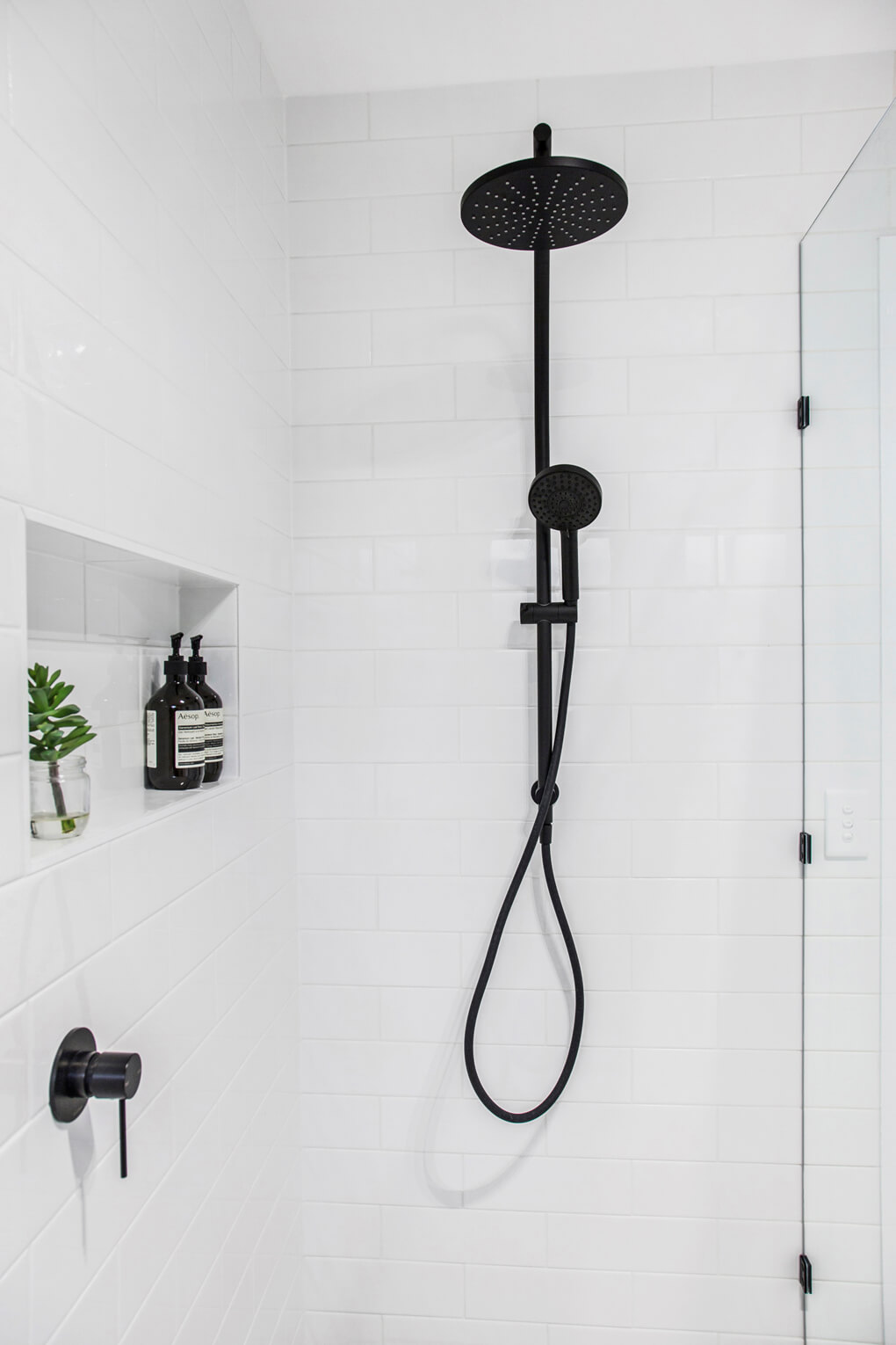 A custom designed bathroom featuring subway tiles. Designed and built by MJ Harris Group. #MJHxArmstrongSt