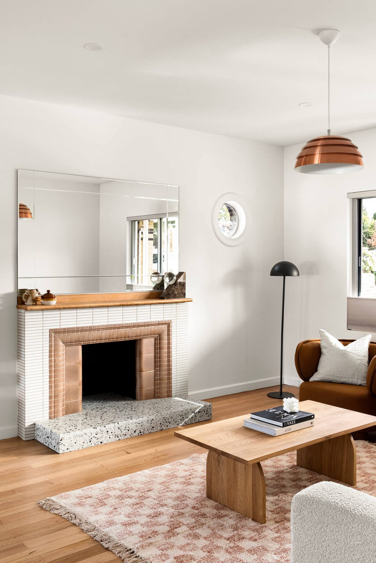 A custom designed living space featuring a tiled fireplace. Designed and built by MJ Harris Group. #MJHxMasonSt