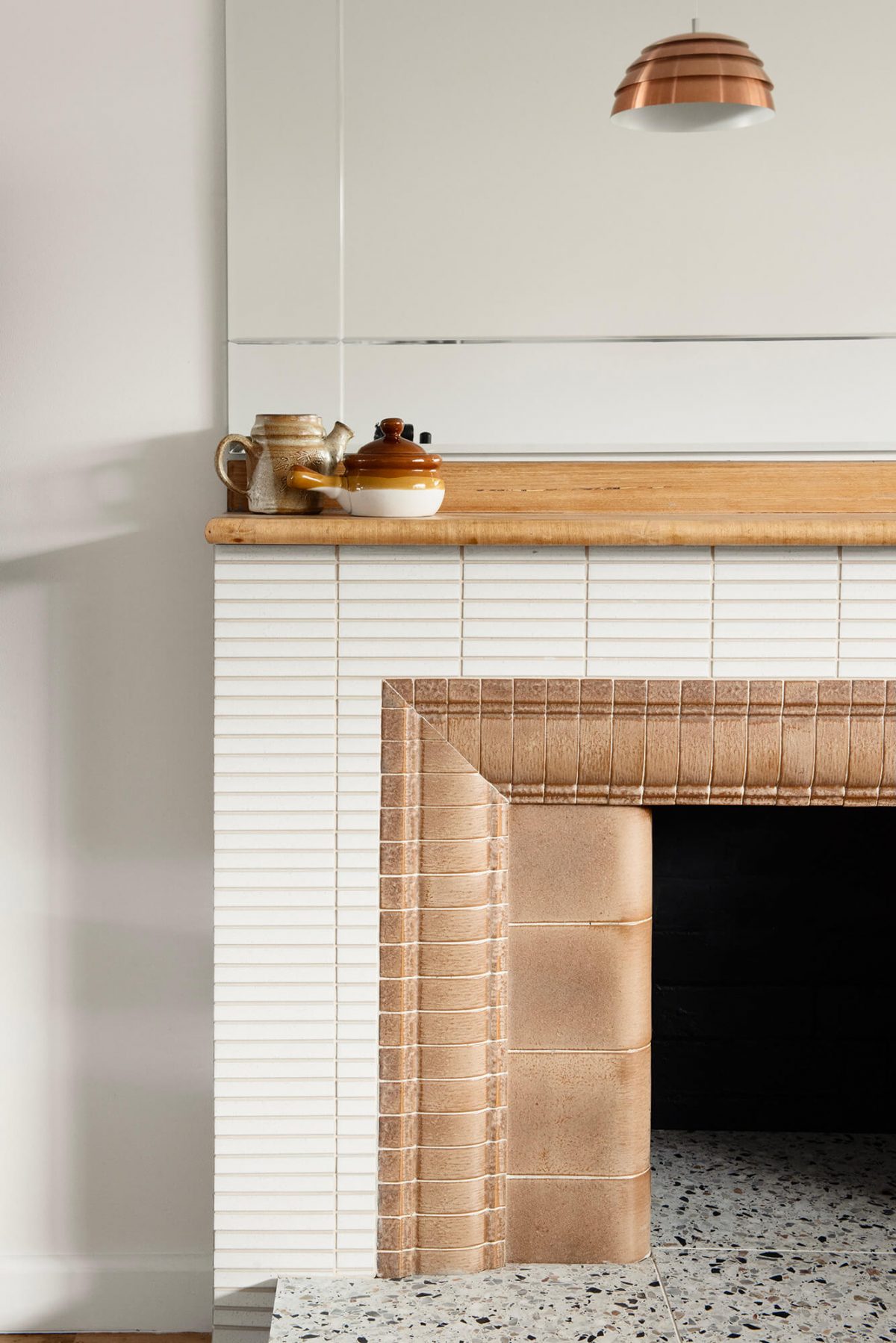 A custom designed living space featuring a tiled fireplace. Designed and built by MJ Harris Group. #MJHxMasonSt