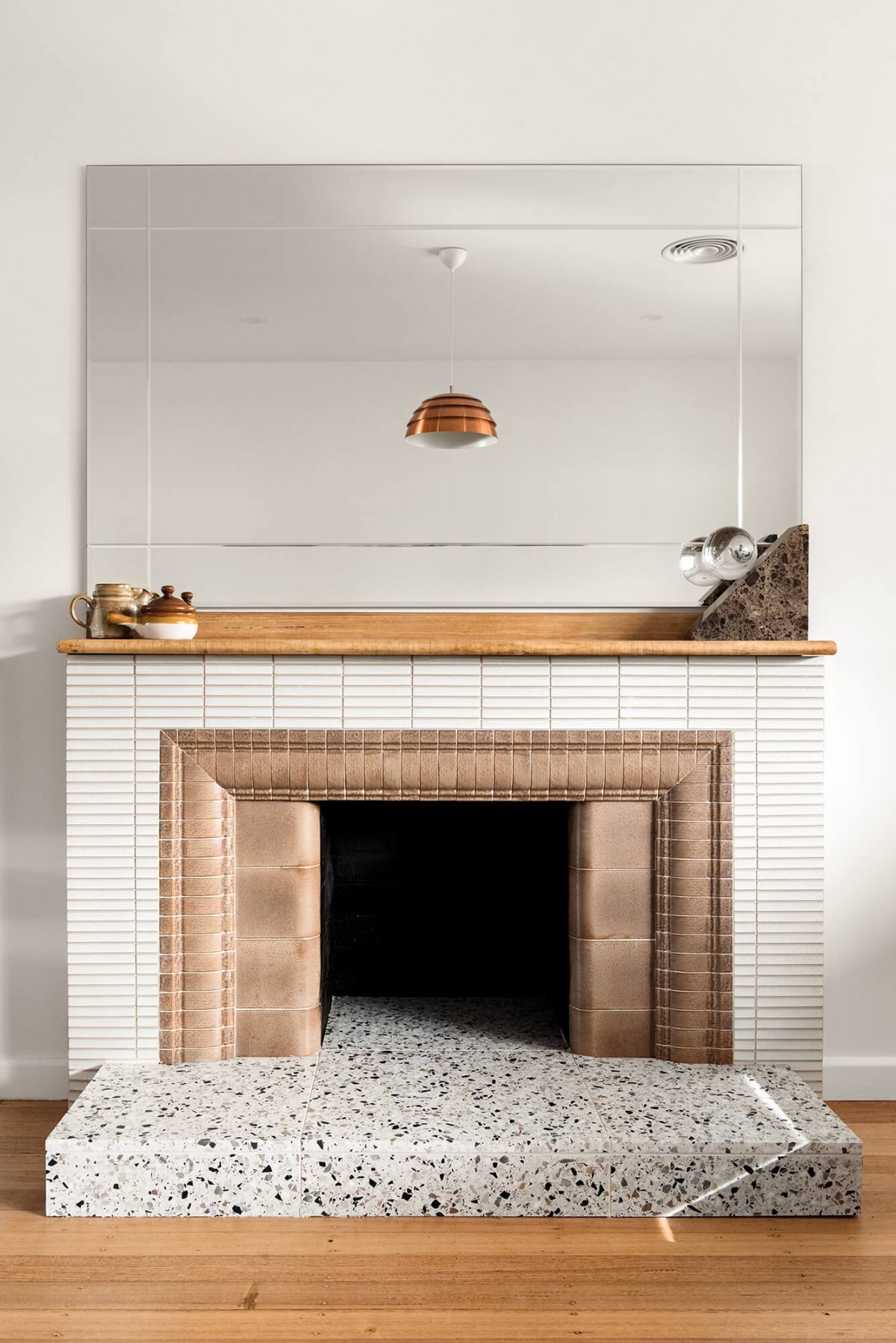 A custom designed living space featuring a tiled fireplace. Designed and built by MJ Harris Group. #MJHxMasonSt