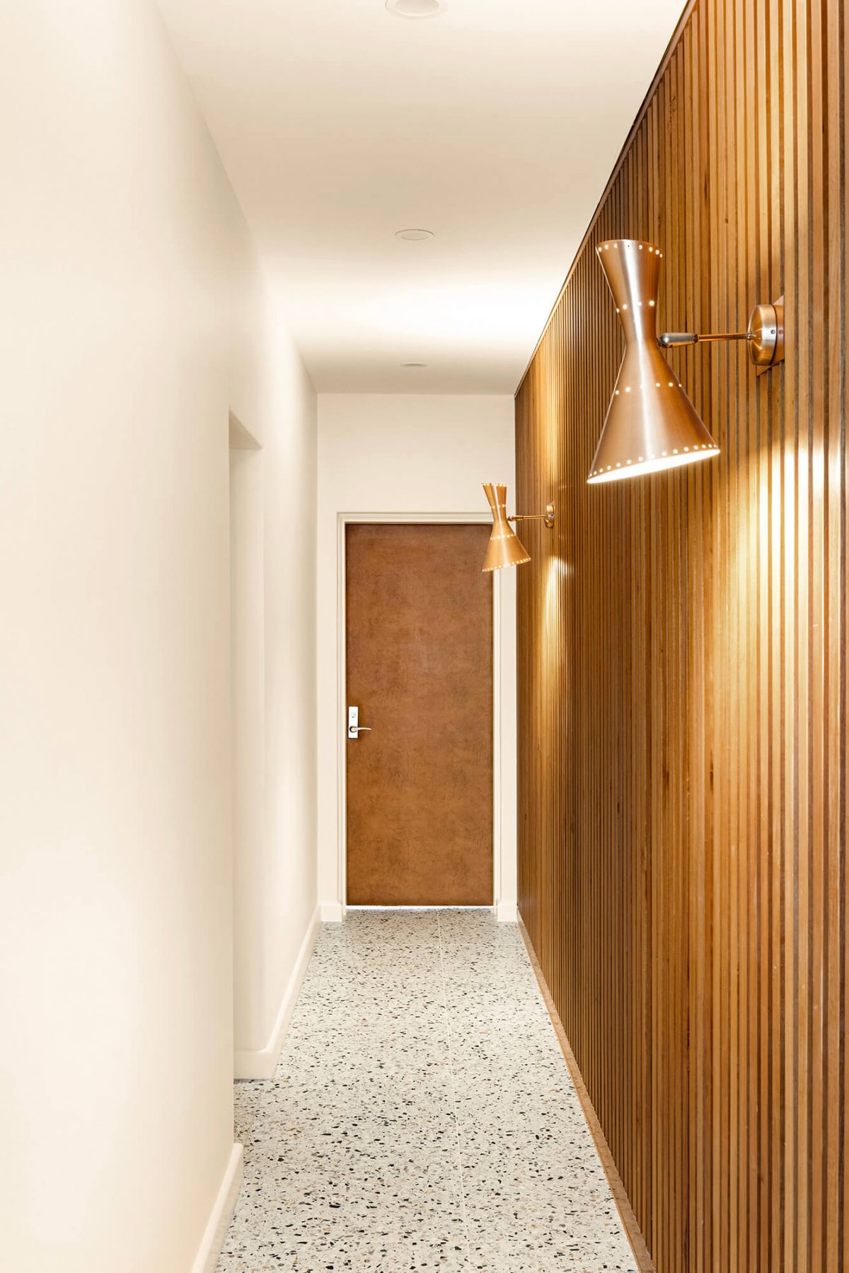 A custom designed hallway featuring terrazzo. Designed and built by MJ Harris Group. #MJHxMasonSt