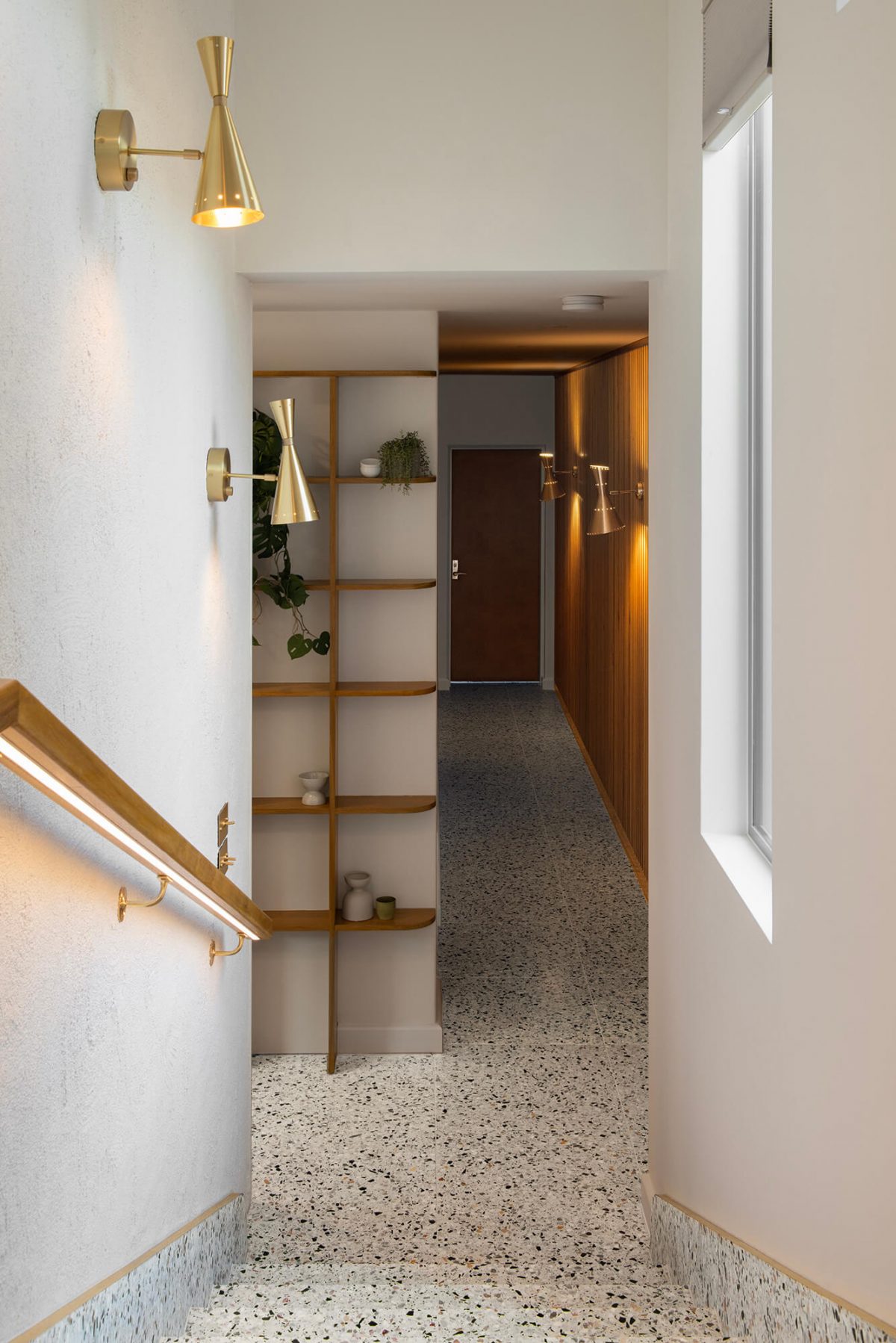 A custom designed hallway featuring terrazzo. Designed and built by MJ Harris Group. #MJHxMasonSt