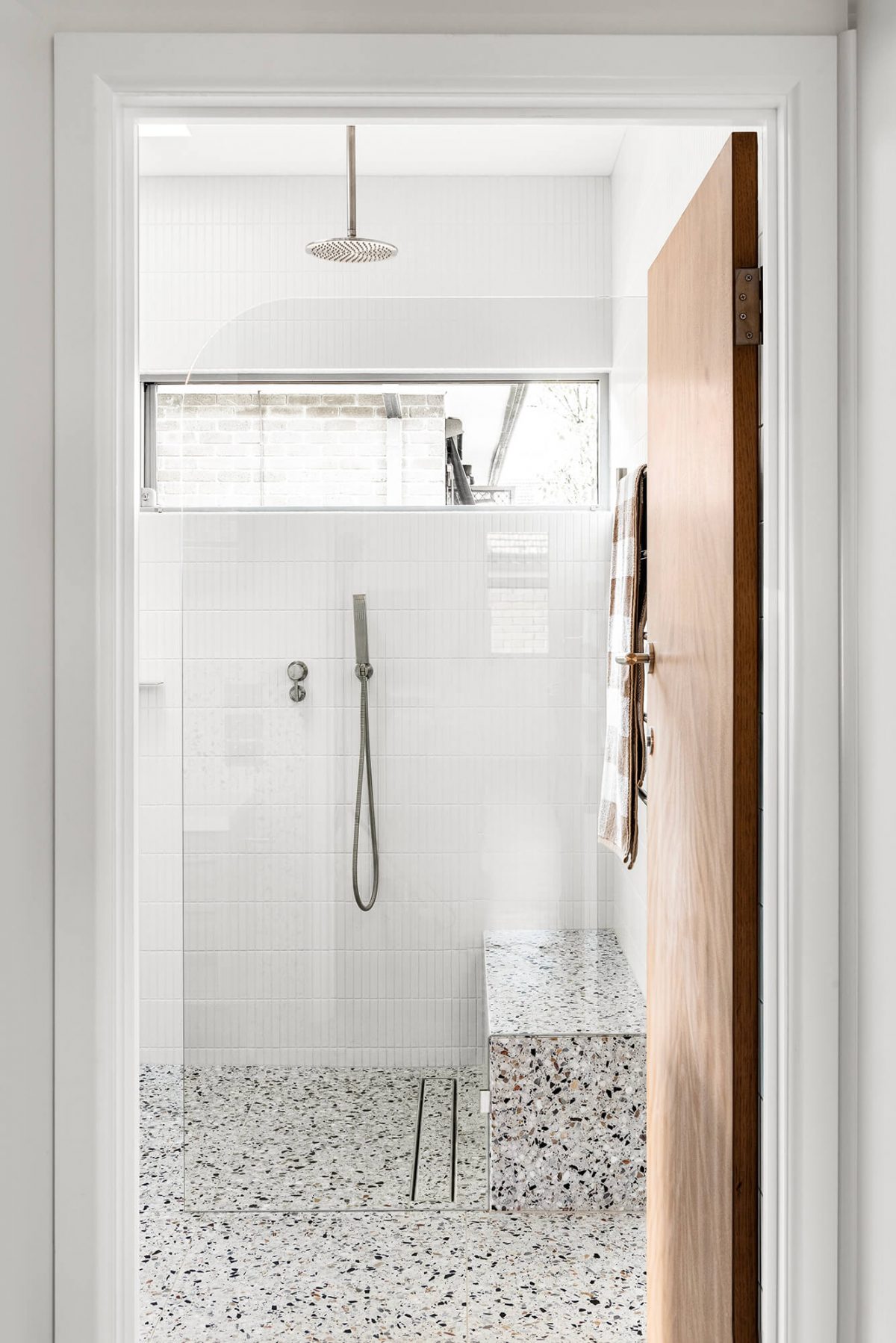 A custom designed bathroom featuring terrazzo tiles. Designed and built by MJ Harris Group. #MJHxMasonSt