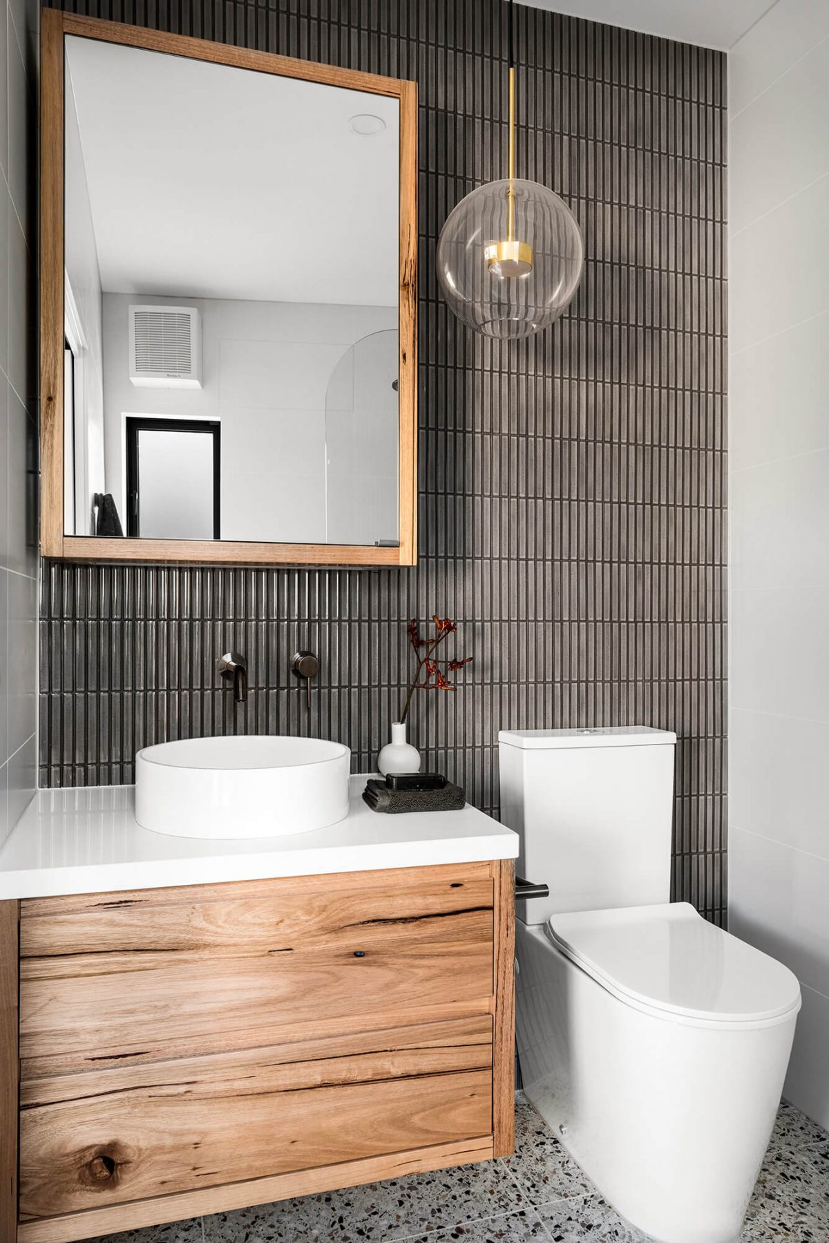 A custom designed bathroom featuring dark Kit Kat tiles. Designed and built by MJ Harris Group. #MJHxMasonSt