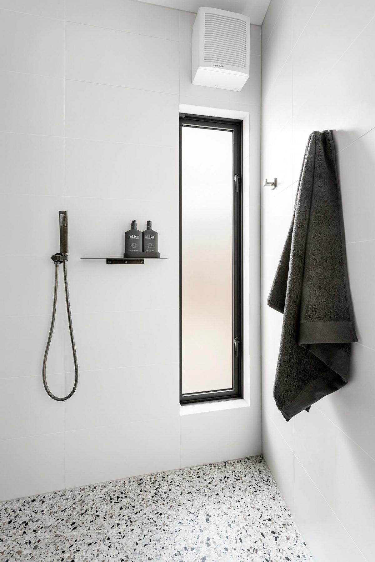 A custom designed bathroom featuring white tiles. Designed and built by MJ Harris Group. #MJHxMasonSt