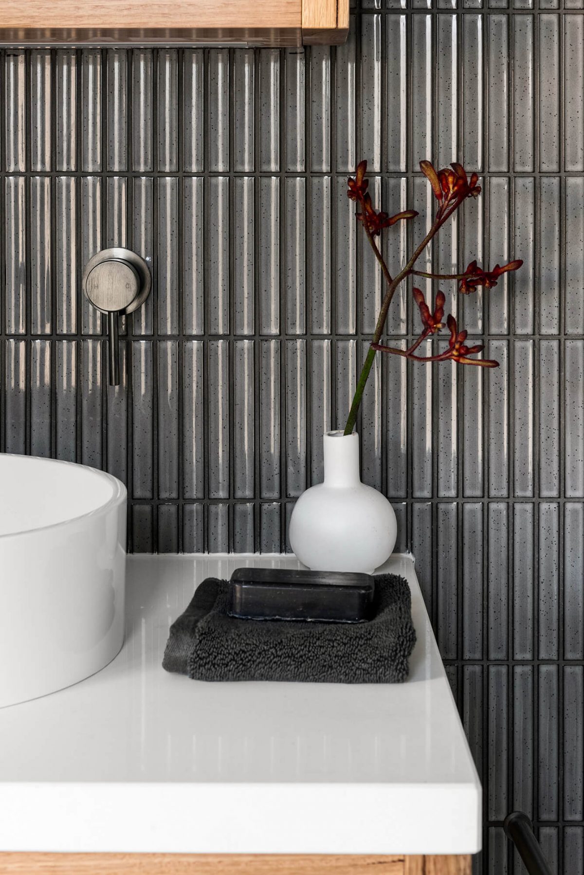 A custom designed bathroom featuring dark Kit Kat tiles. Designed and built by MJ Harris Group. #MJHxMasonSt