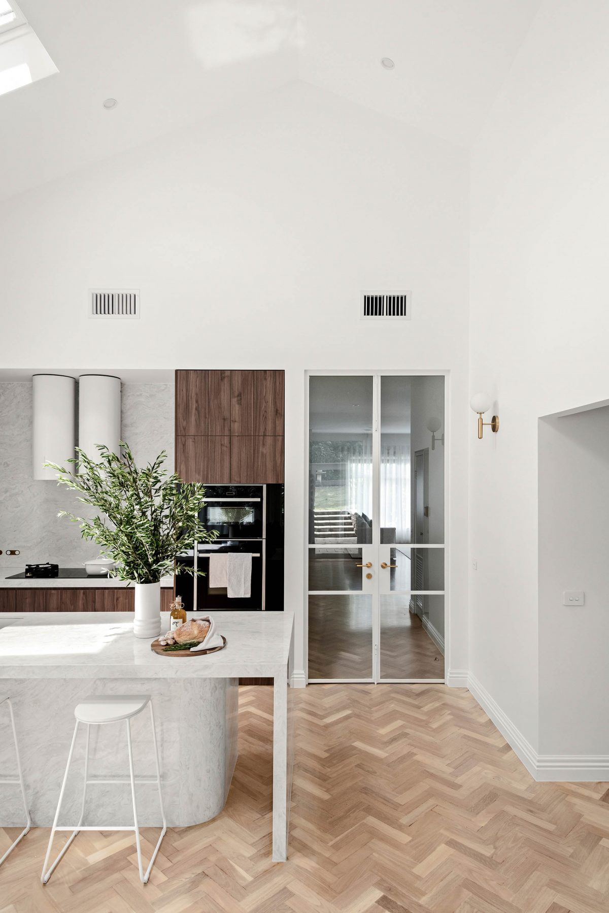 Kitchen A custom designed kitchen featuring a stone island and custom joinery. Designed and built by MJ Harris Group. #MJHxHawdonSt
