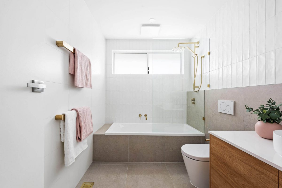 A custom designed bathroom featuring gold accents. Designed and built by MJ Harris Group. #MJHxThompsonSt