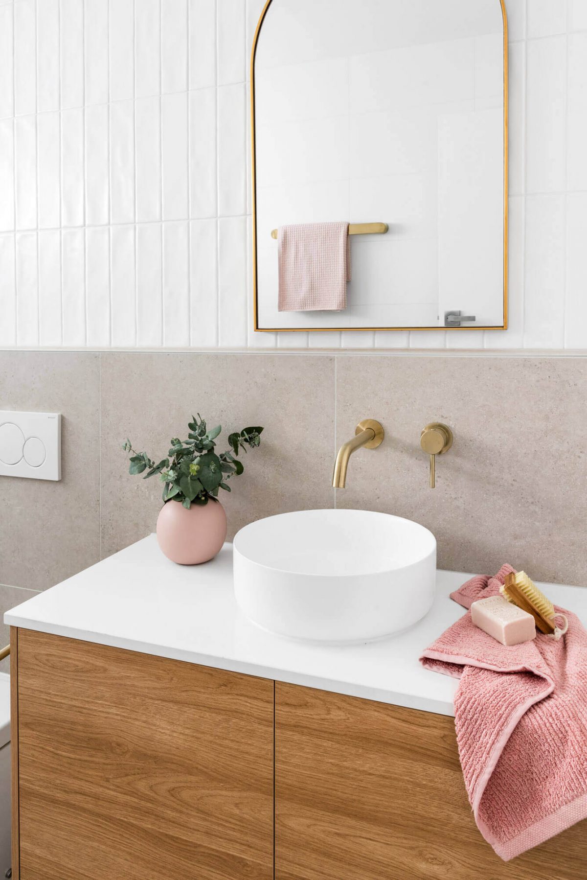 A custom designed bathroom featuring a white basin and gold accents. Designed and built by MJ Harris Group. #MJHxThompsonSt