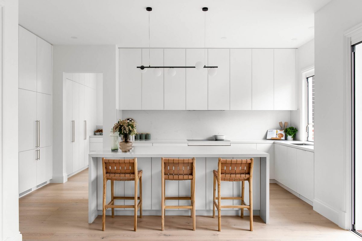 A custom designed kitchen featuring white custom joinery. Designed and built by MJ Harris Group. #MJHxFitzgibbonCres