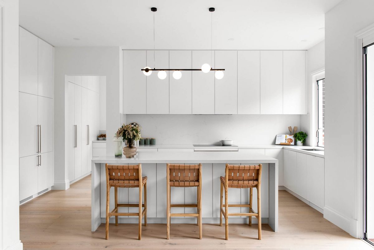 A custom designed kitchen featuring white custom joinery. Designed and built by MJ Harris Group. #MJHxFitzgibbonCres