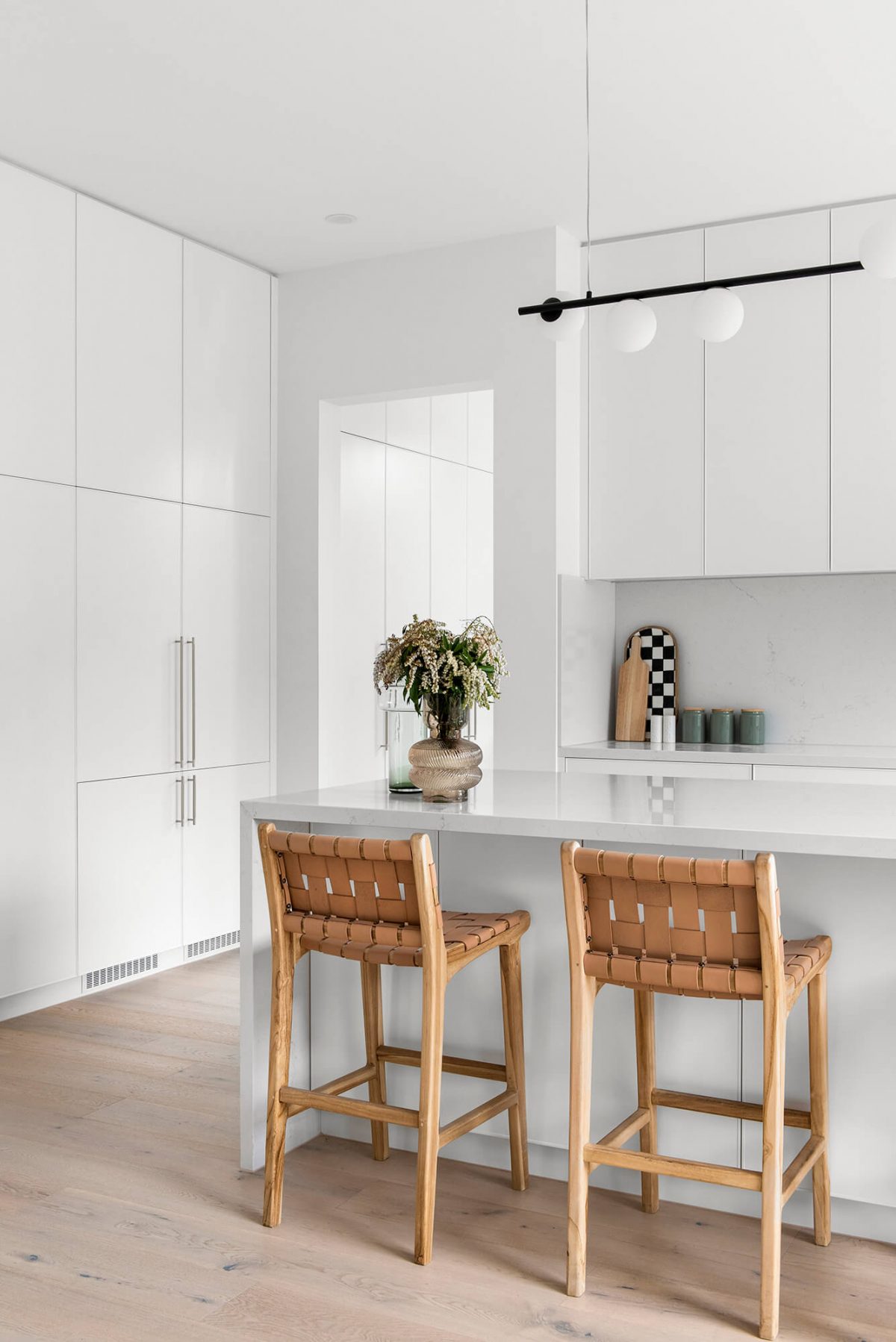 A custom designed kitchen featuring white custom joinery. Designed and built by MJ Harris Group. #MJHxFitzgibbonCres