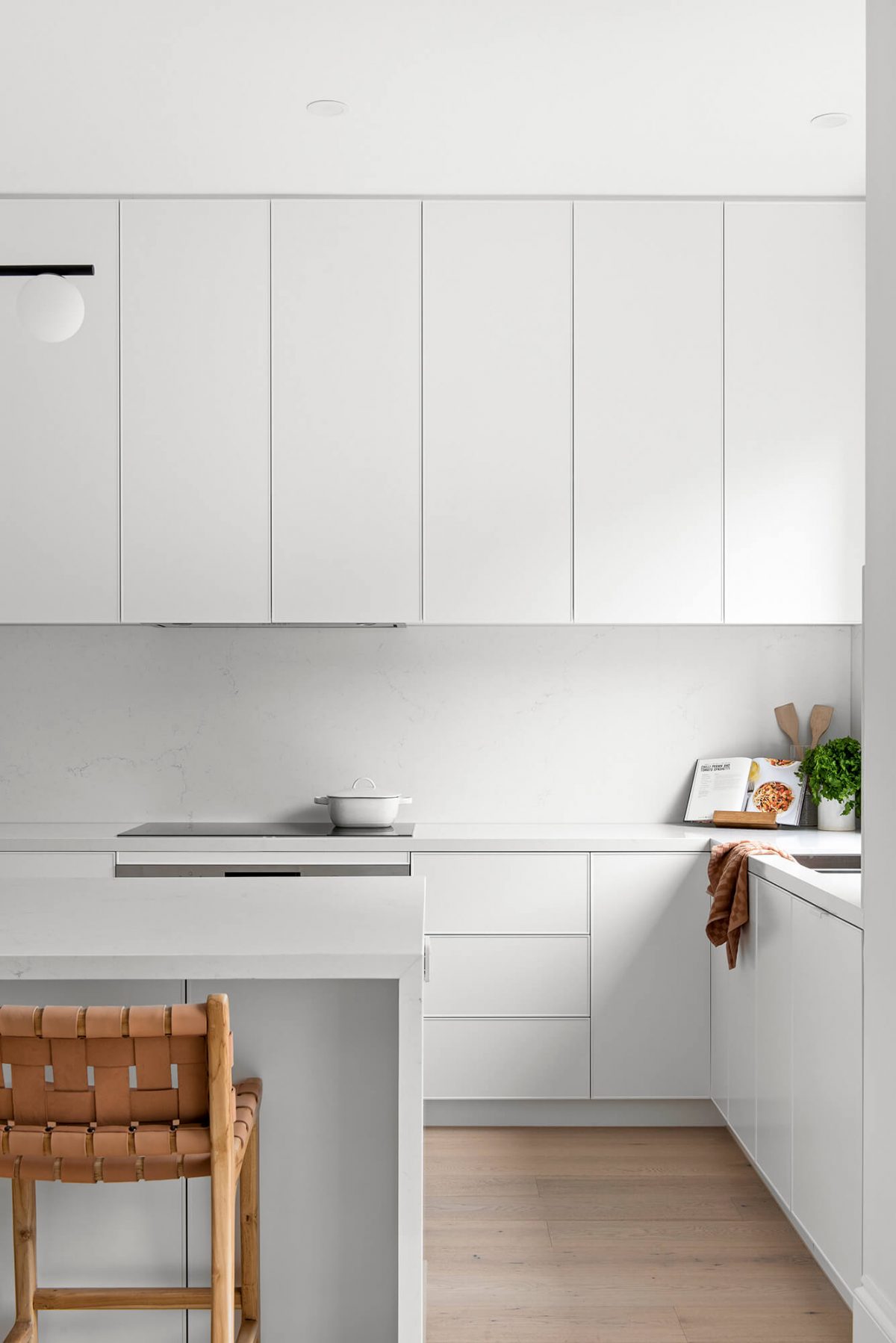 A custom designed kitchen featuring white custom joinery. Designed and built by MJ Harris Group. #MJHxFitzgibbonCres