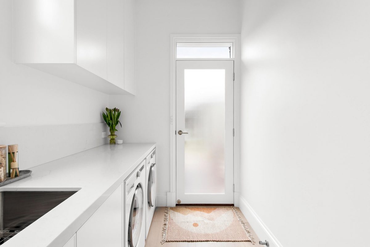 A custom designed laundry featuring custom joinery. Designed and built by MJ Harris Group. #MJHxFitzgibbonCres