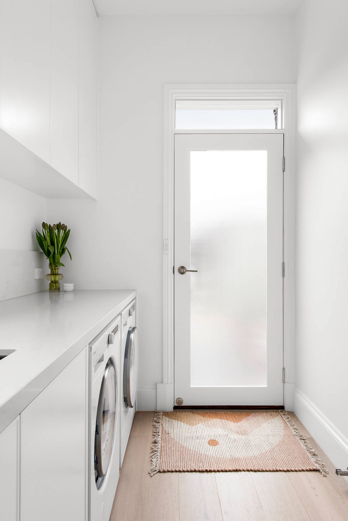 A custom designed laundry featuring custom joinery. Designed and built by MJ Harris Group. #MJHxFitzgibbonCres