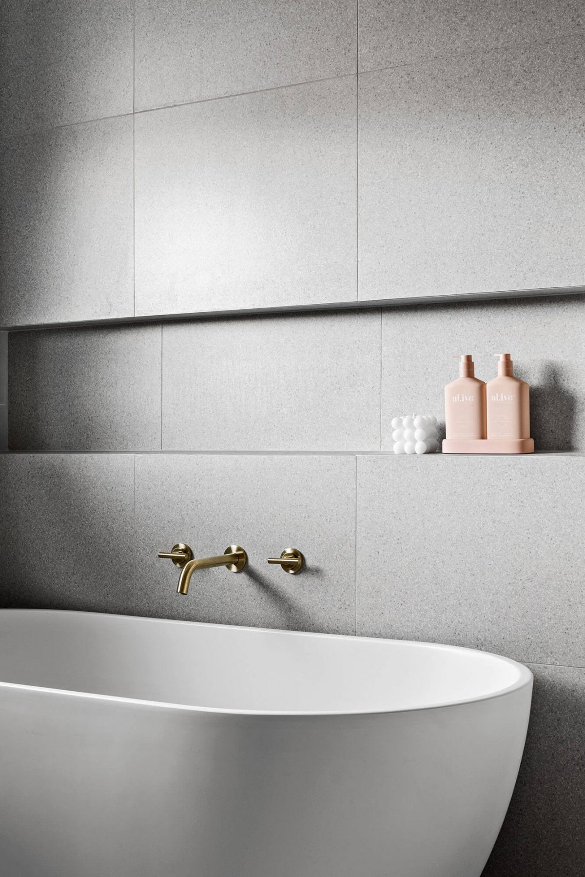A custom designed bathroom featuring a free standing bathtub. Designed and built by MJ Harris Group. #MJHxNaroomaSt