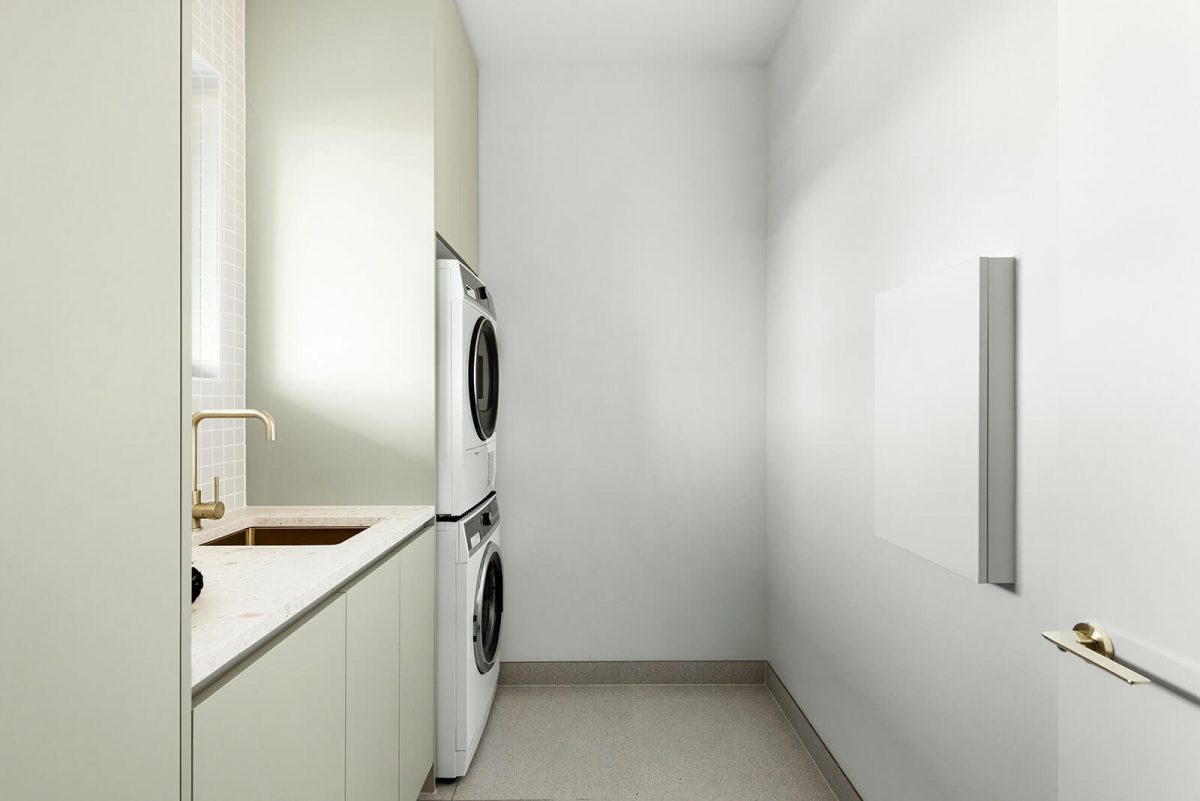 A custom designed laundry featuring gold tapware. Designed and built by MJ Harris Group. #MJHxNaroomaSt