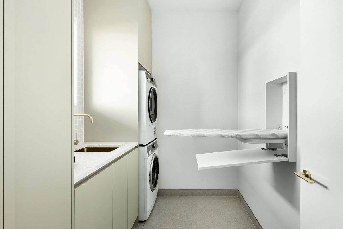 A custom designed laundry featuring gold tapware. Designed and built by MJ Harris Group. #MJHxNaroomaSt