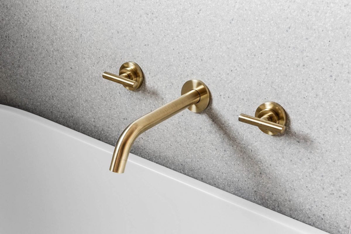 A custom designed bathroom featuring brass tapware. Designed and built by MJ Harris Group. #MJHxNaroomaSt