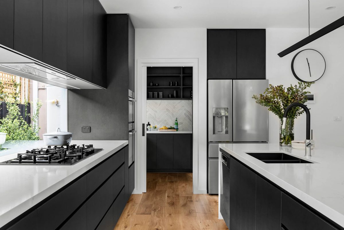 A custom designed kitchen featuring a monochrome style. Designed and built by MJ Harris Group. #MJHxBaySt