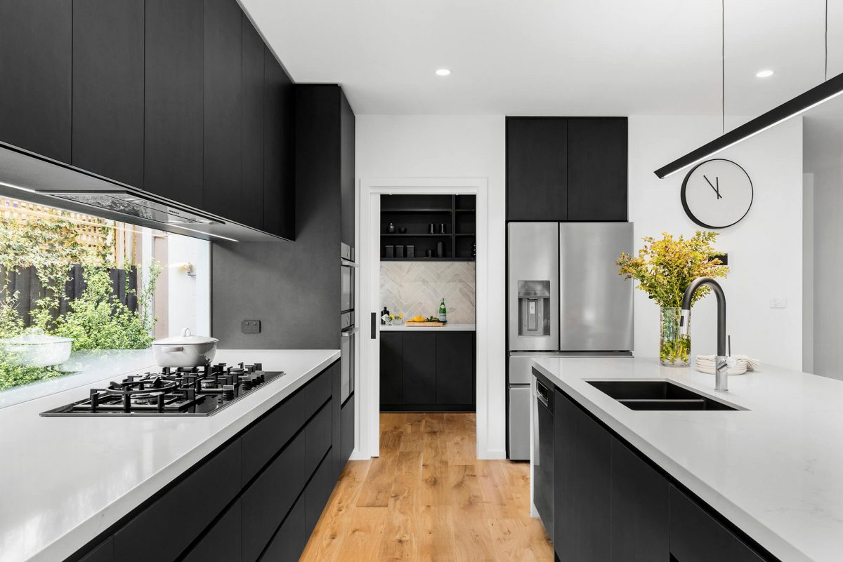 A custom designed kitchen featuring a monochrome style. Designed and built by MJ Harris Group. #MJHxBaySt