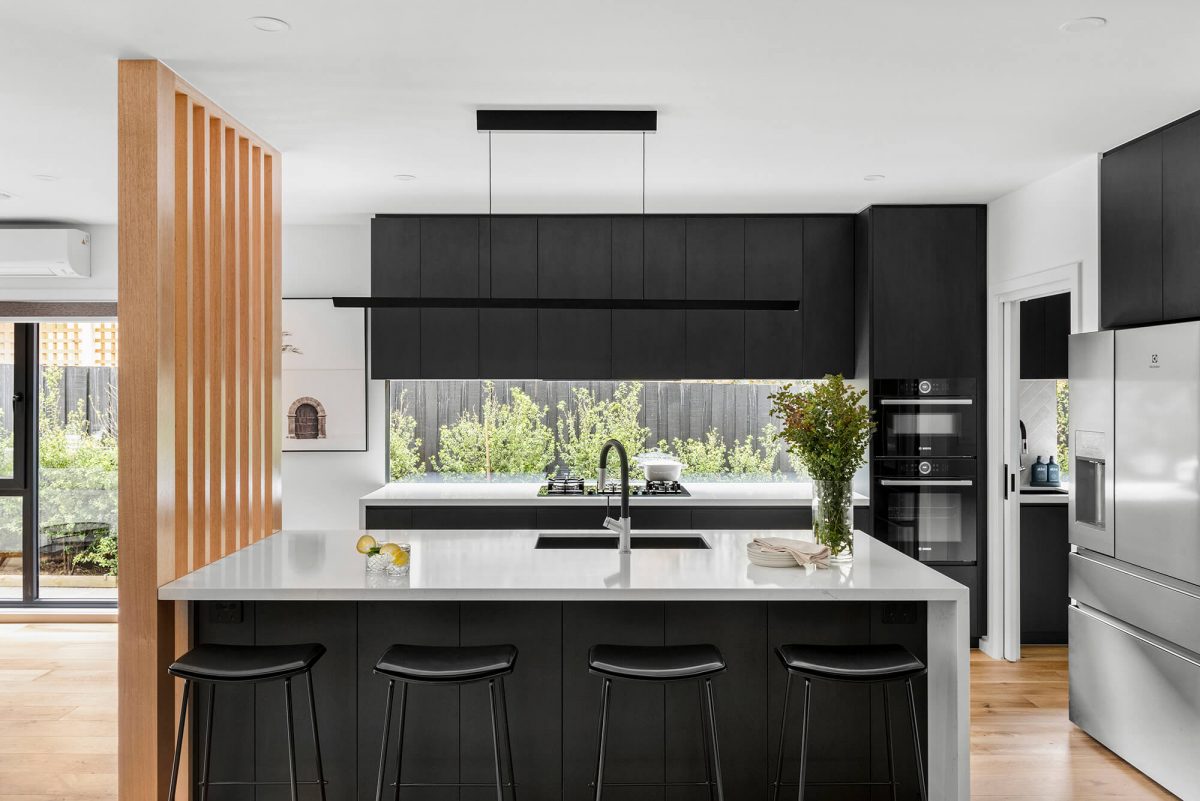 Black Kitchen Renovation in Brighton, Melbourne. Timber Batten Wall Stone Benchtop Butlers Pantry