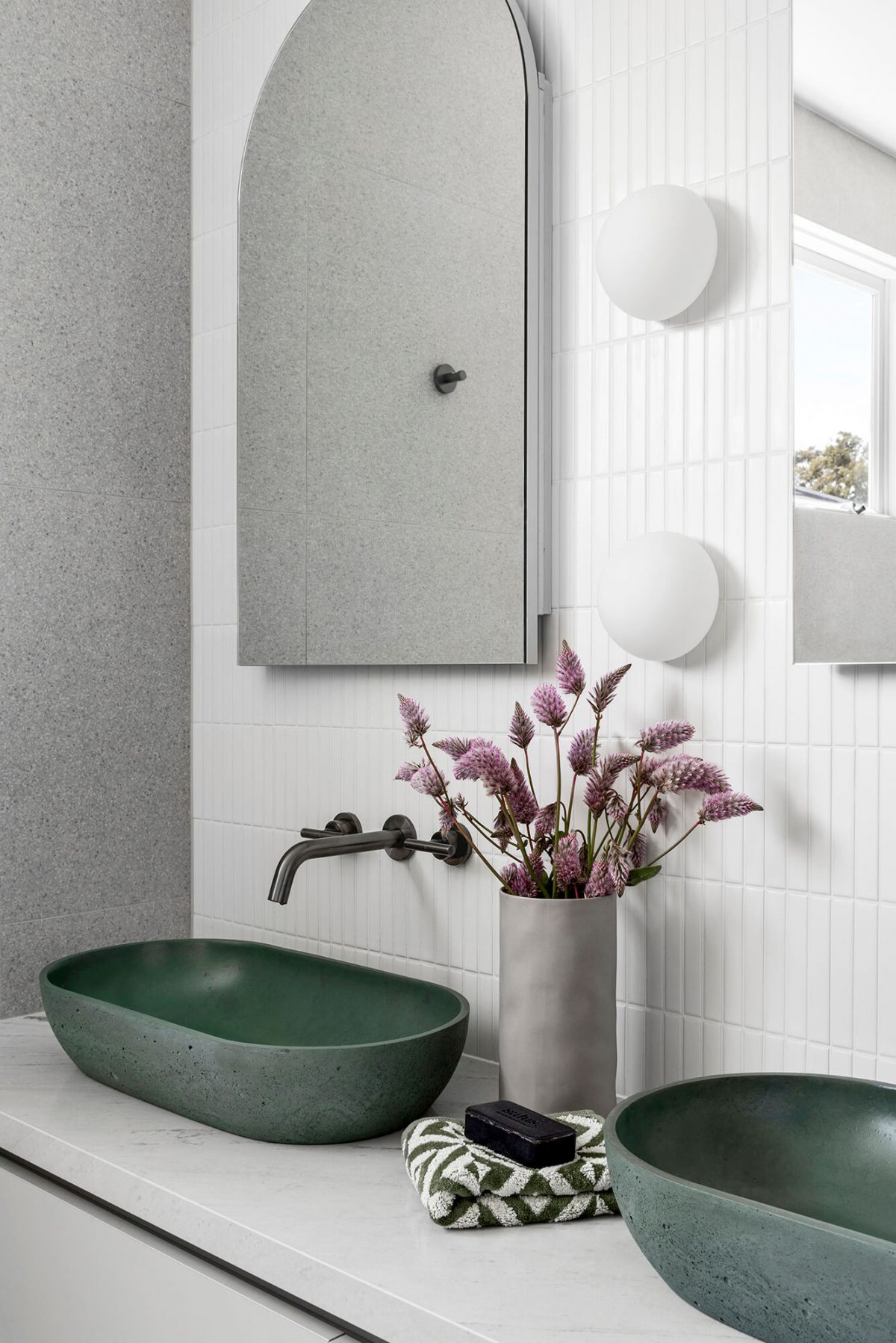 Olive green concrete poured basin stone benchtop custom double vanity kit kat tile brushed gunmetal tapware arched mirror