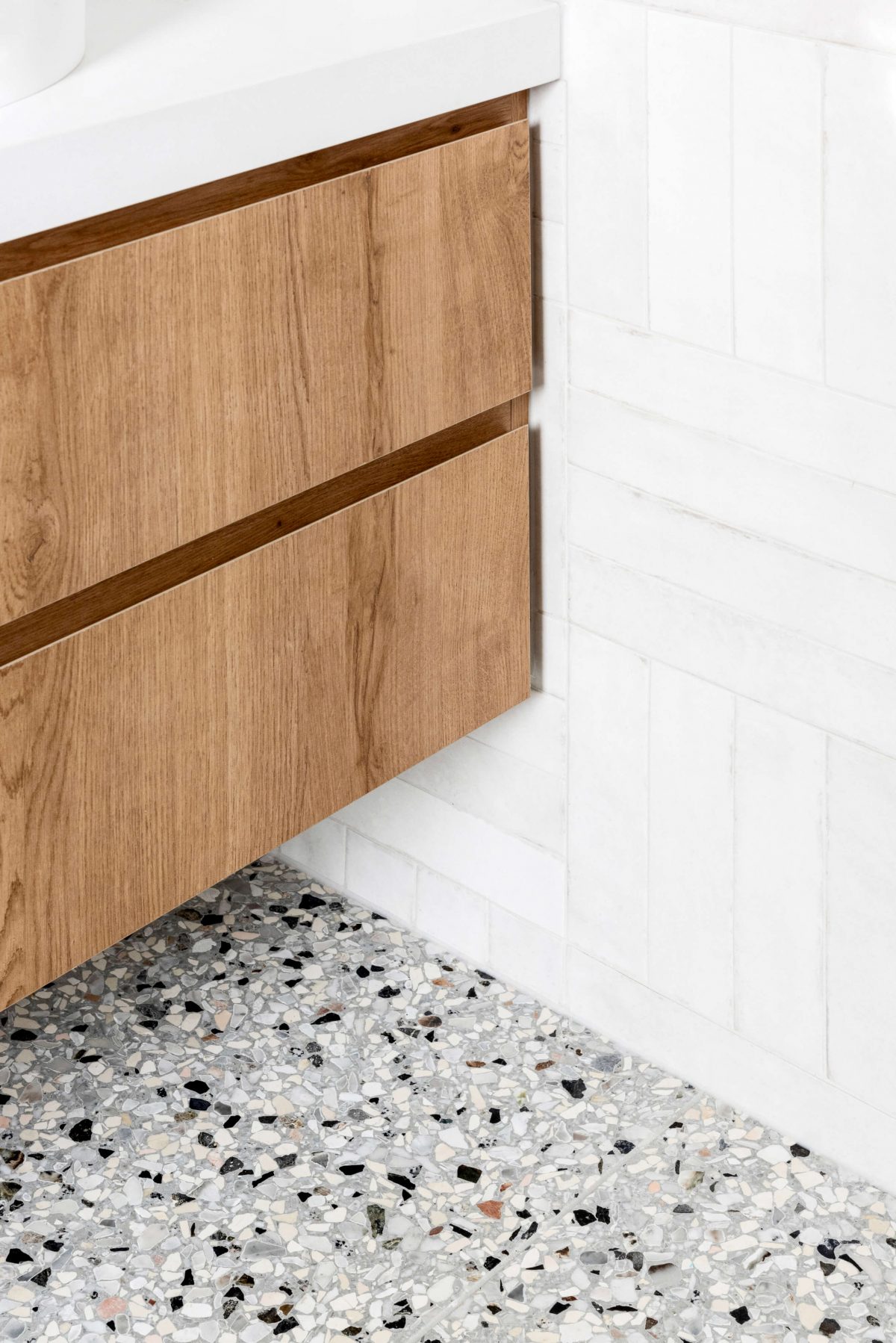 A custom designed bathroom featuring terrazzo tiling and custom joinery. Designed and built by MJ Harris Group. #MJHxPeppinSt