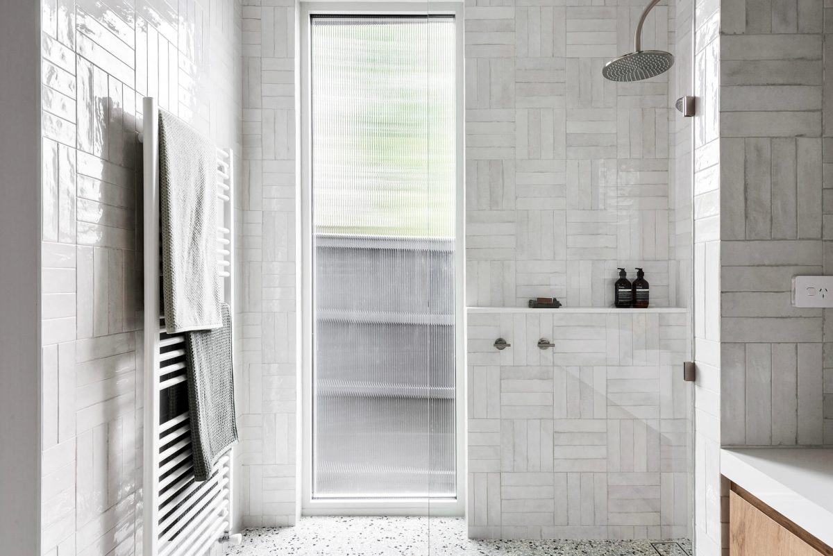 Walk in Shower Patchwork Crosshath Tile Pattern Spanish Subway Tiles Tiled Shower Ledge Heater Towel Rail Fluted Glass Window Bathroom Ensuite Renovation Camberwell, Melbourne