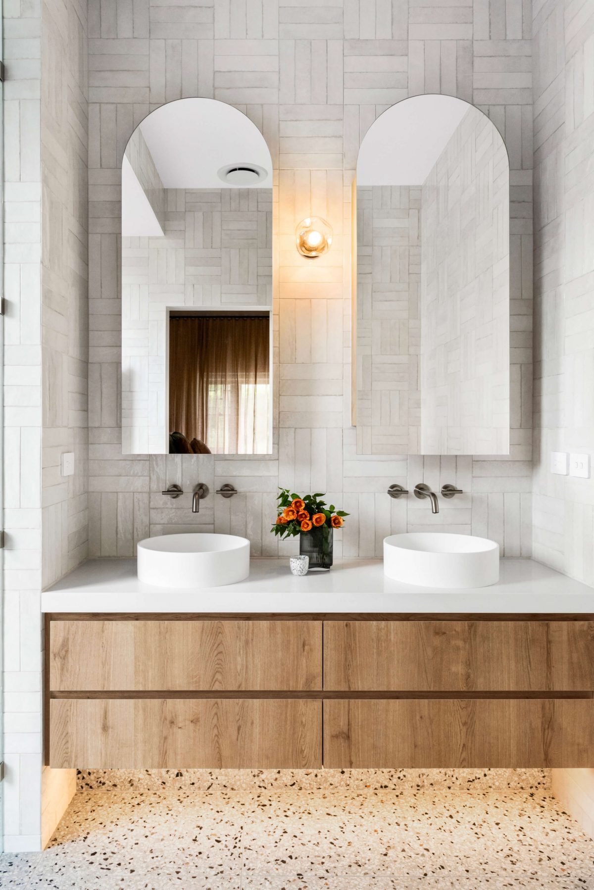 Bathroom Renovation Camberwell, Melbourne Double Vanity Arched Shaving Cabinet Mirrors Custom Joinery Spanish Subway Tile Crosshatch Pattern Natural Terrazzo Tiled Floor LED Strip Lighting