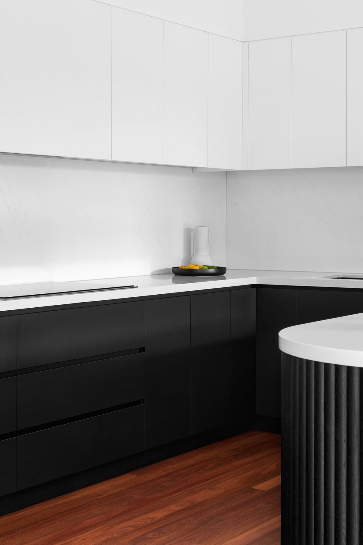 A custom designed kitchen featuring a monochromatic curved island bench. Designed and built by MJ Harris Group. #MJHxGrandviewGr