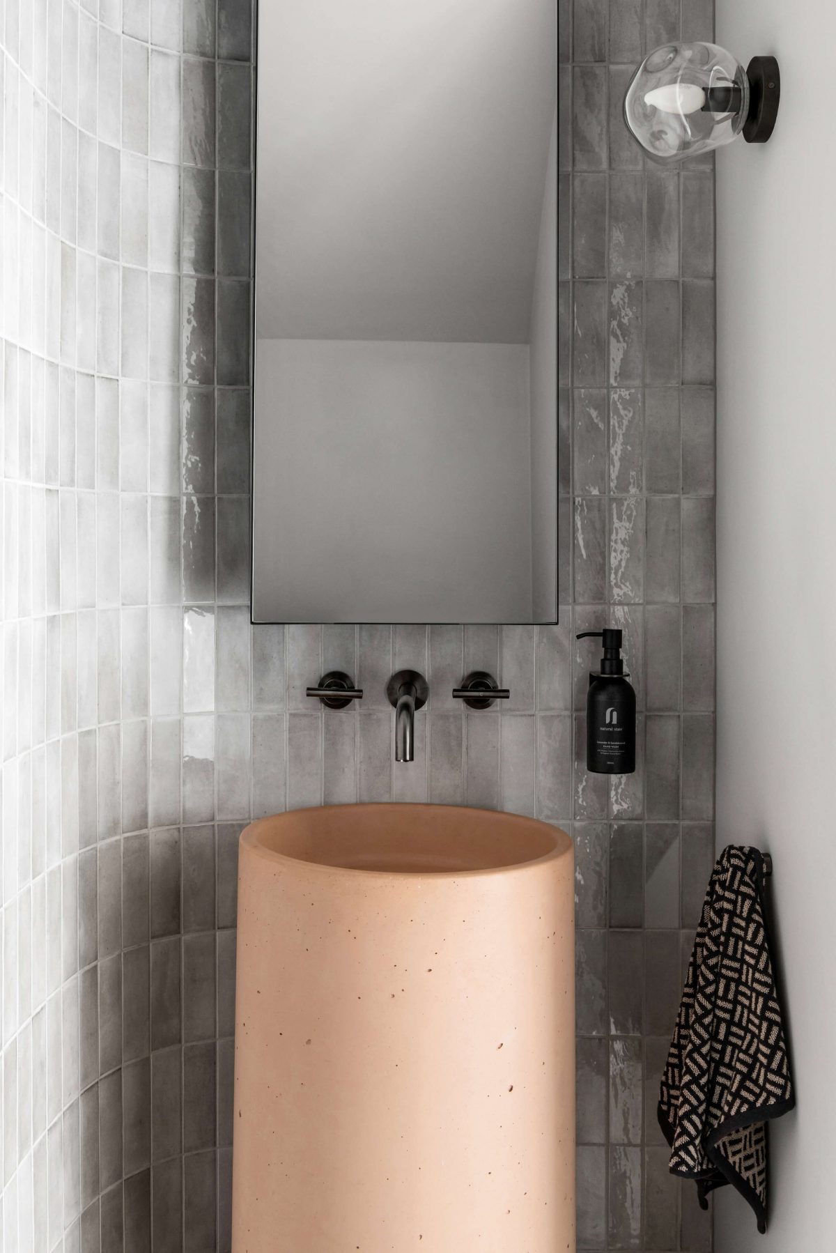 Hanging Mirror Pink Concrete Basin Gunmetal Tapware Curved Tiled Feature Wall Bathroom Renovation Melbourne