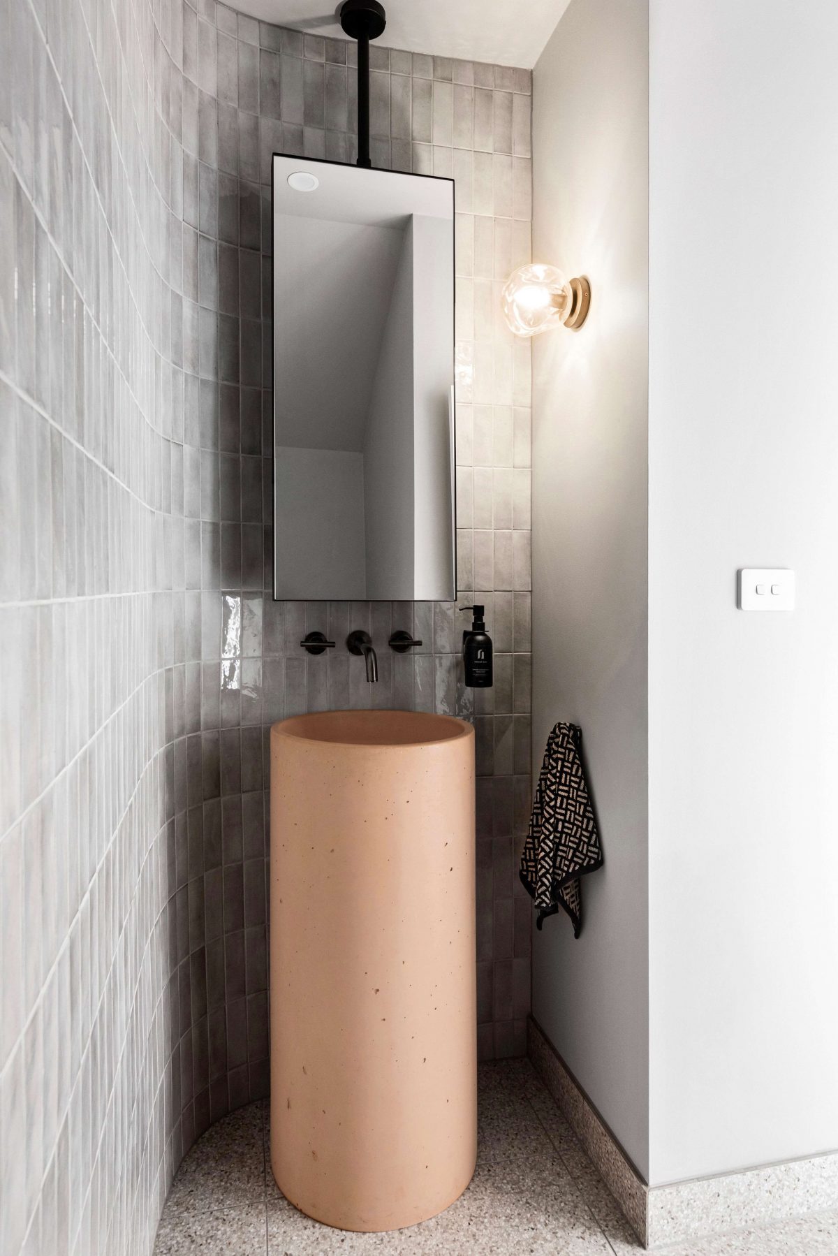 Powder Room Interior Design Melbourne Curved Tiled Feature Wall Hanging Mirror Pink Concrete Pillar Basin