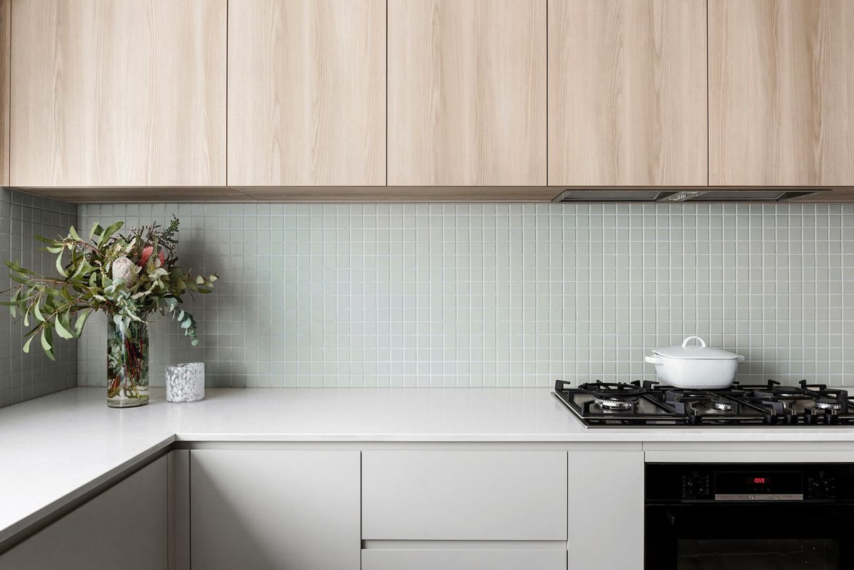 A custom designed kitchen featuring a green tile. Designed and built by MJ Harris Group. #MJHxHeroicCrt