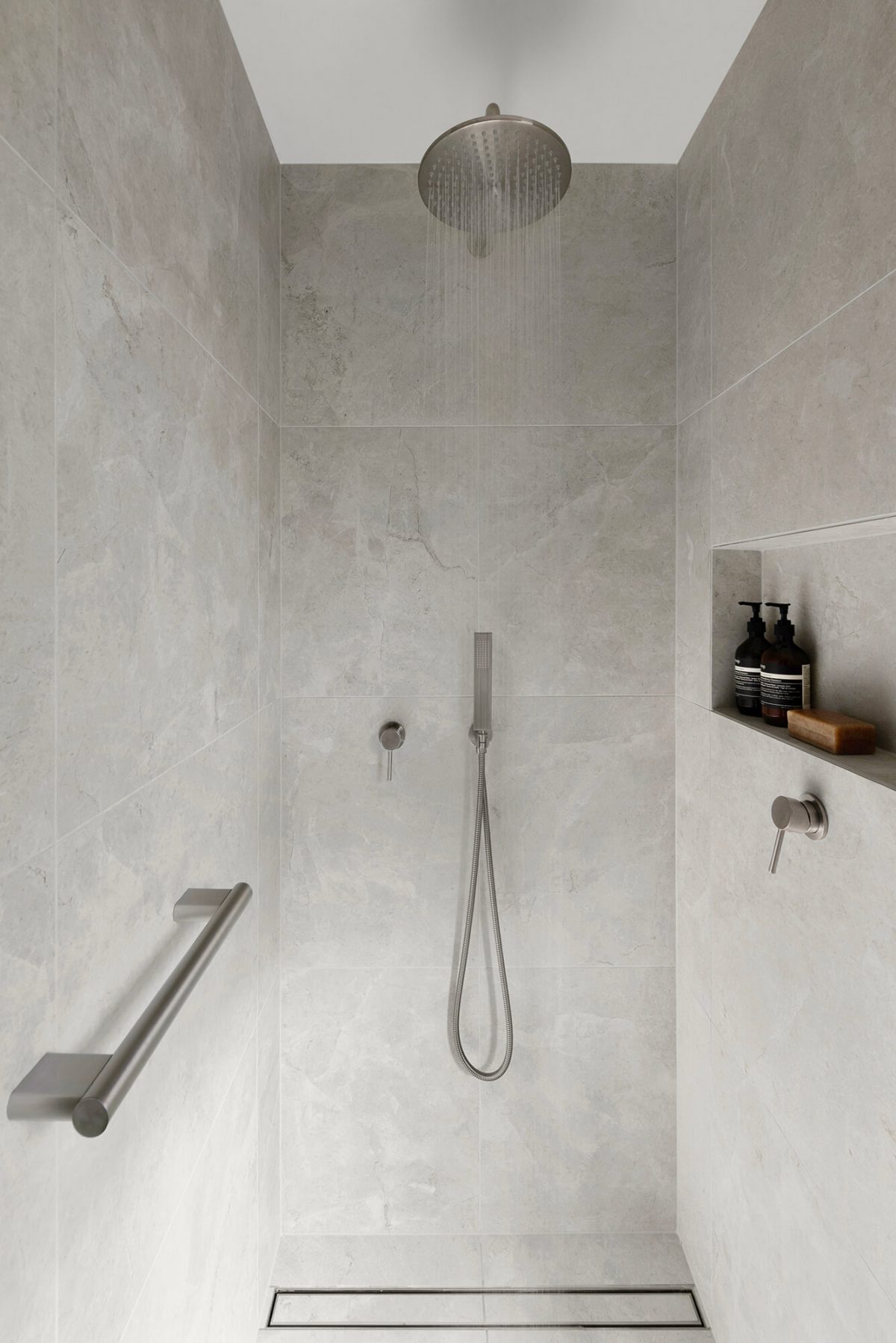 A custom designed bathroom featuring a walk in shower. Designed and built by MJ Harris Group. #MJHxWallisAve