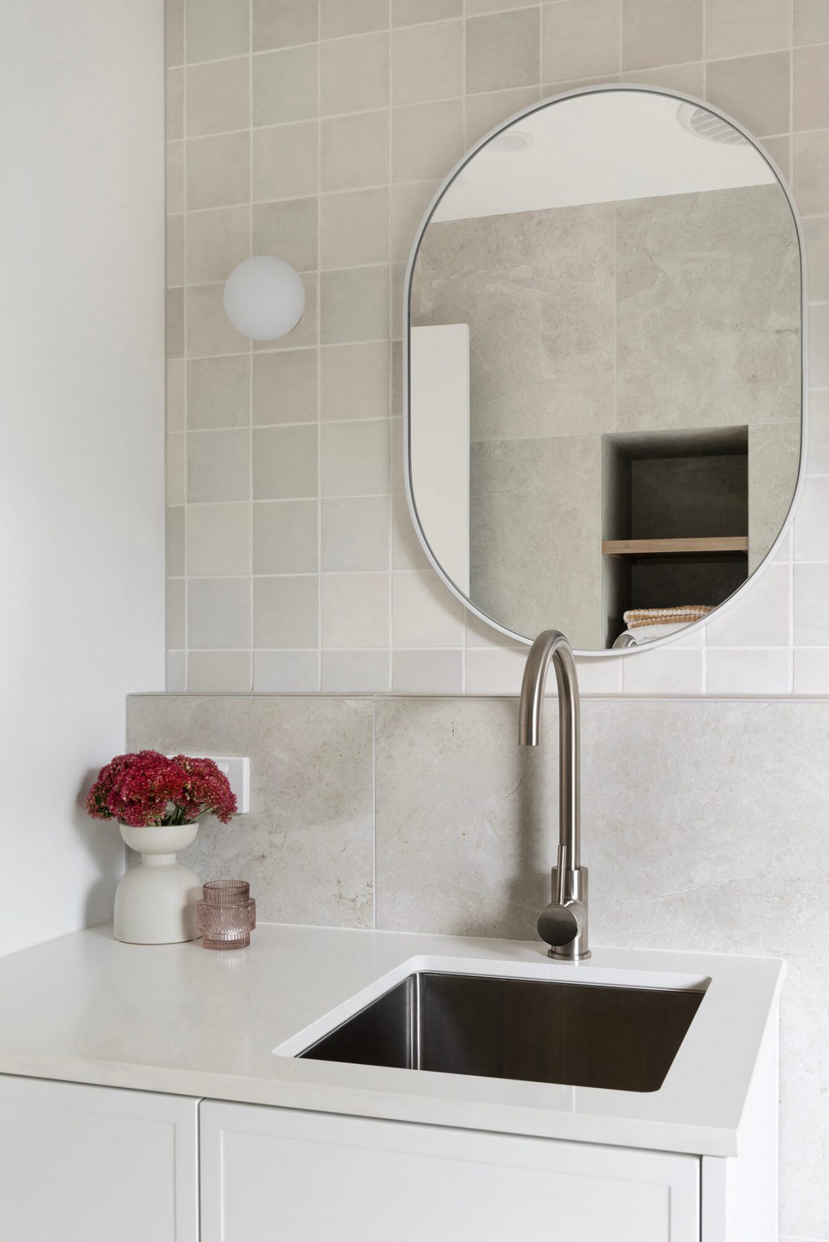 A custom designed bathroom featuring a Melange Bianco tile. Designed and built by MJ Harris Group. #MJHxWallisAve