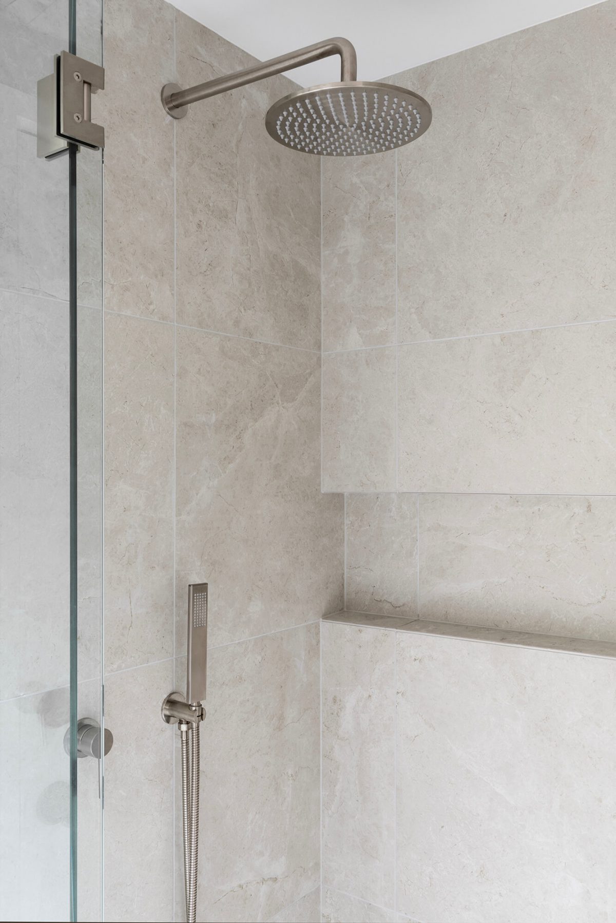 A custom designed bathroom featuring a walk in shower. Designed and built by MJ Harris Group. #MJHxWallisAve