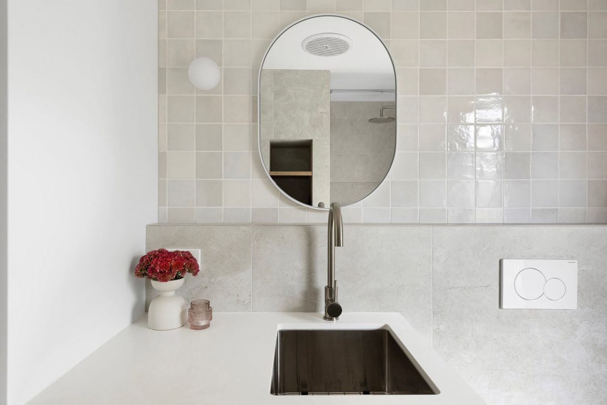 A custom designed bathroom featuring a Melange Bianco tile. Designed and built by MJ Harris Group. #MJHxWallisAve