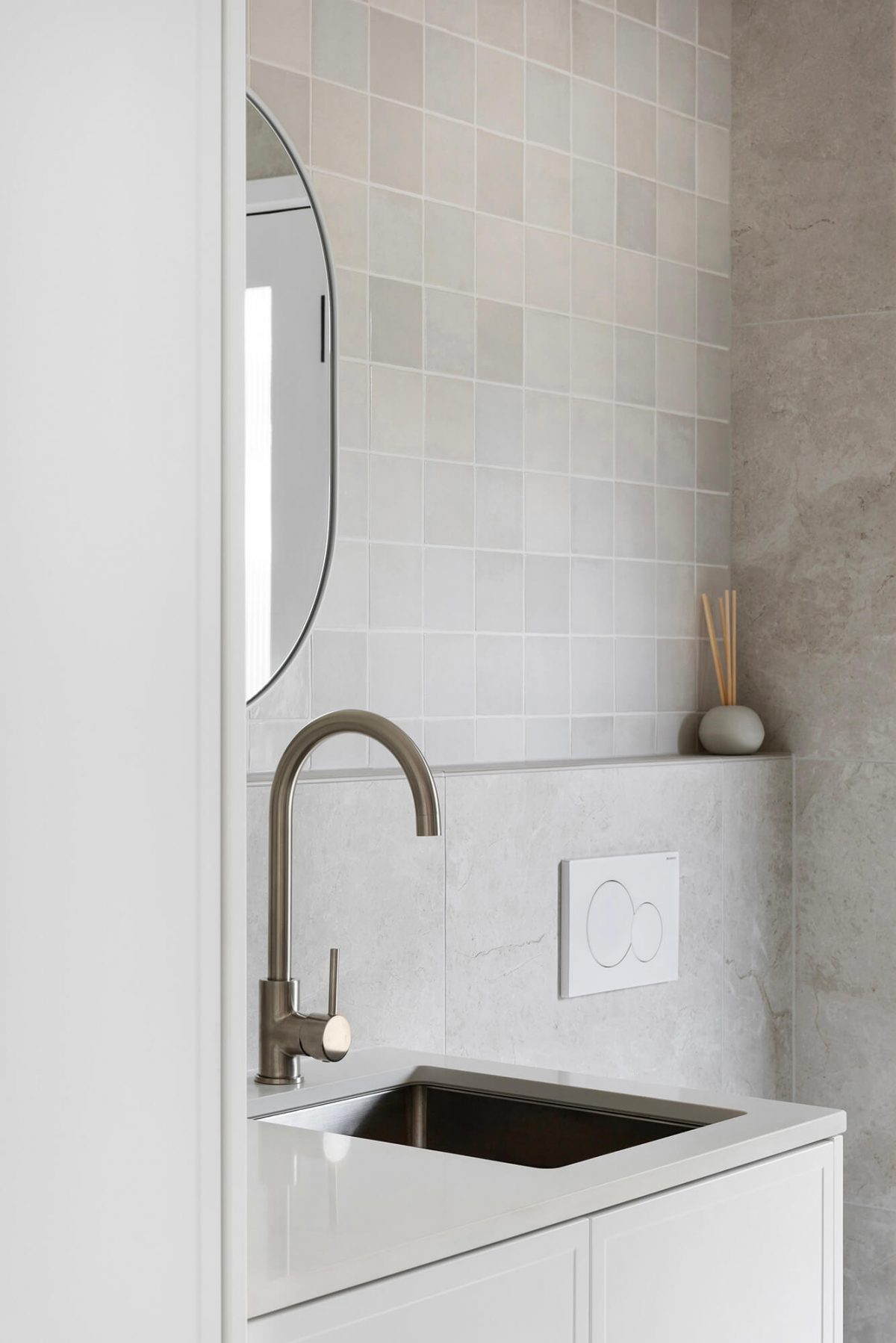A custom designed bathroom featuring a Melange Bianco tile. Designed and built by MJ Harris Group. #MJHxWallisAve
