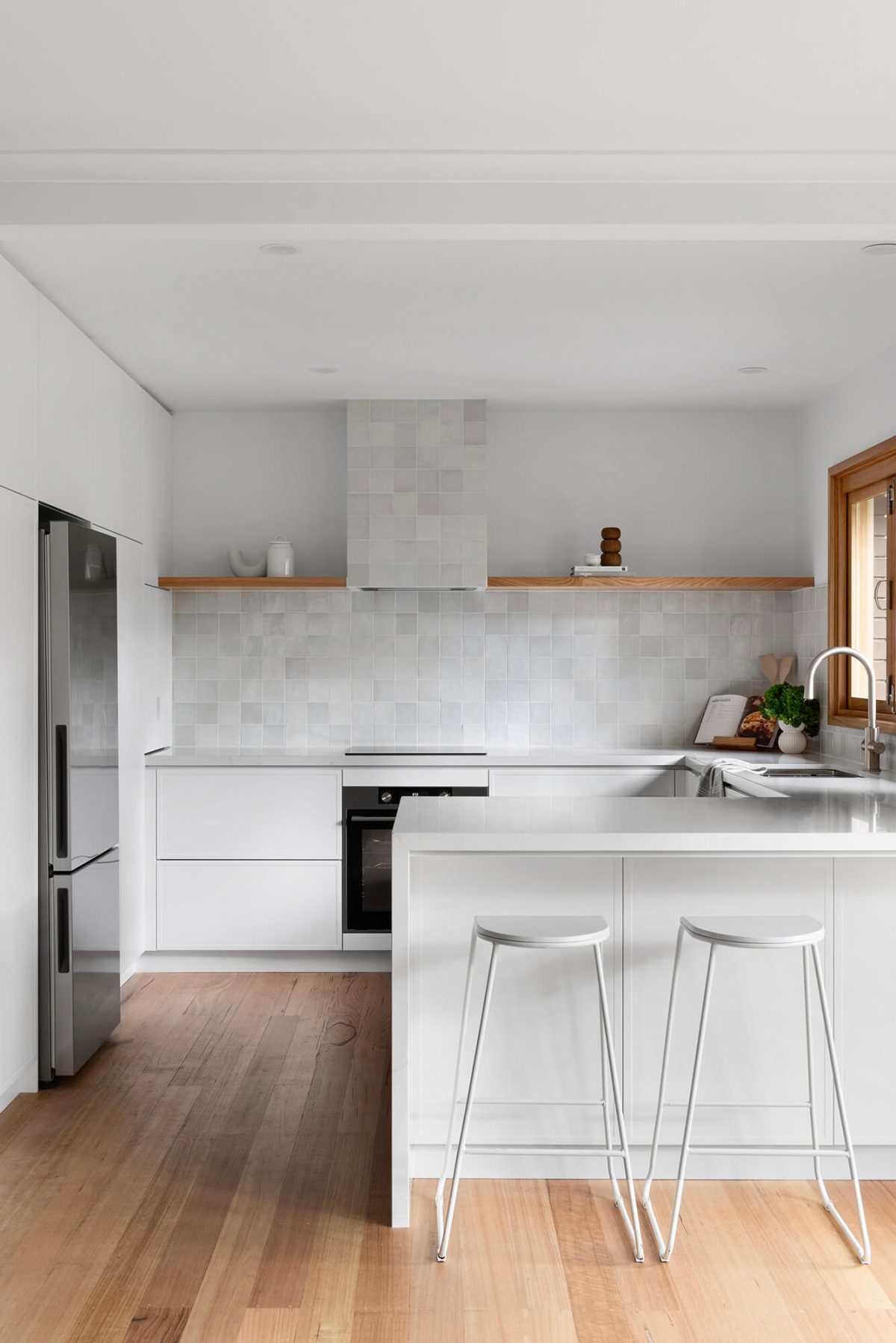A custom designed kitchen featuring a Melange Bianco tile. Designed and built by MJ Harris Group. #MJHxWallisAve