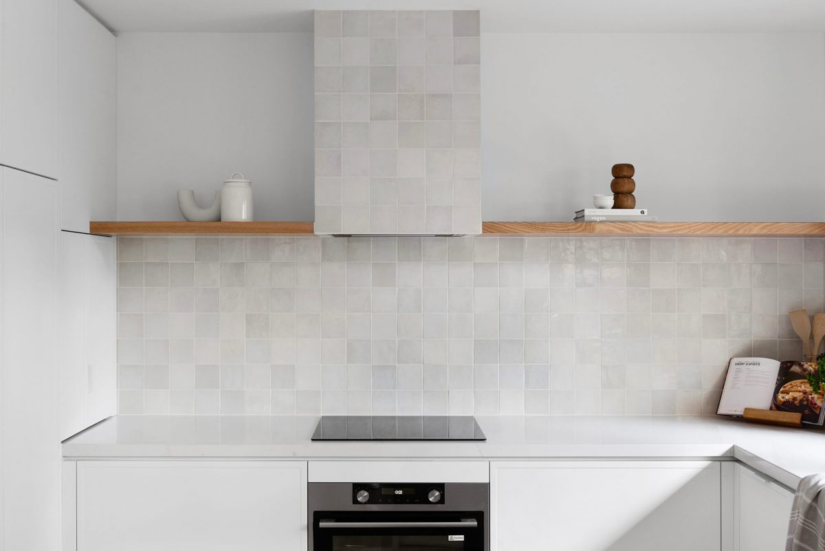 A custom designed kitchen featuring a Melange Bianco tile. Designed and built by MJ Harris Group. #MJHxWallisAve