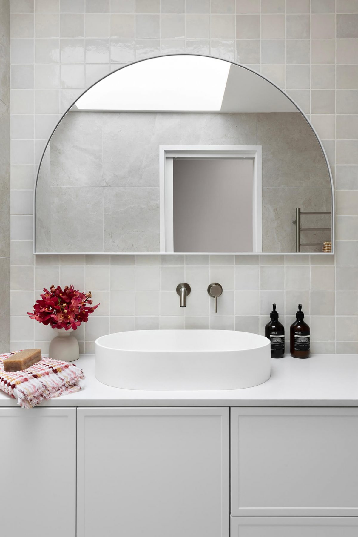 A custom designed bathroom featuring a Melange Bianco tile. Designed and built by MJ Harris Group. #MJHxWallisAve