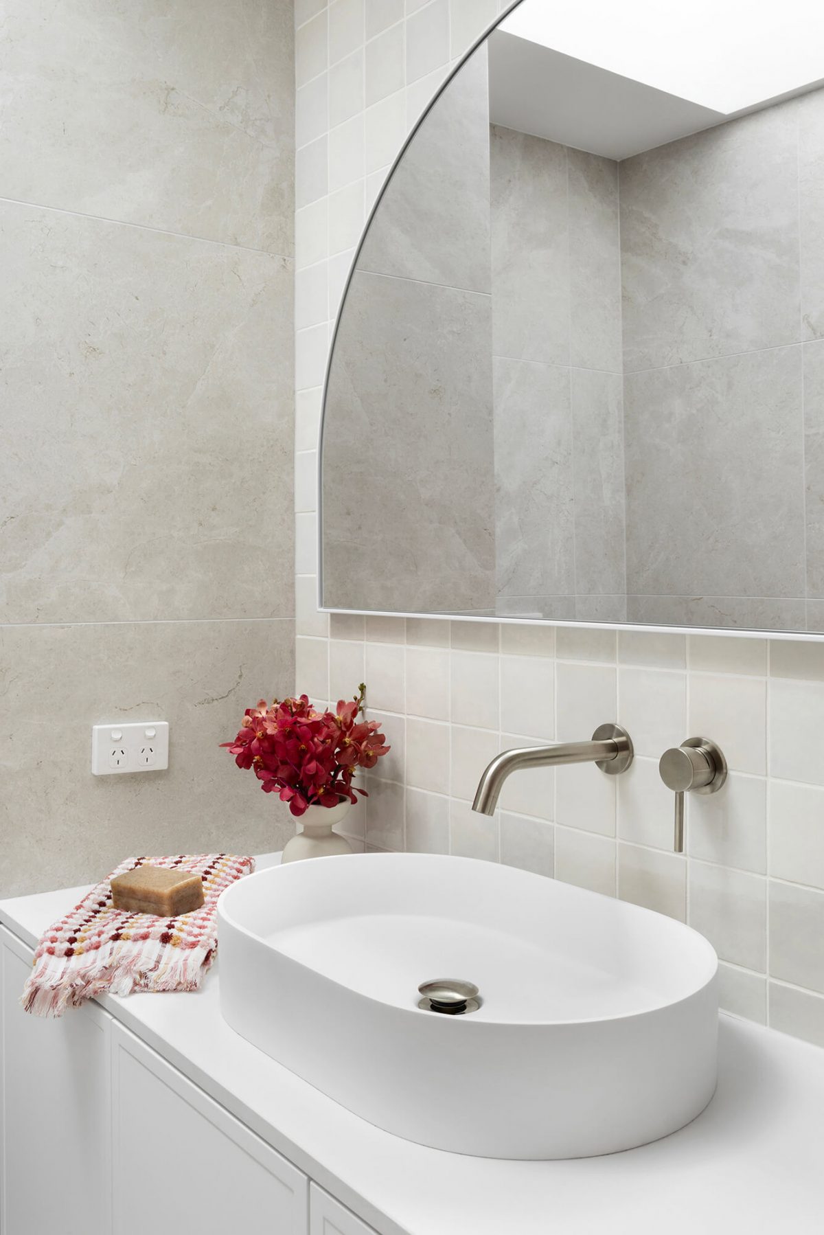 A custom designed bathroom featuring a Melange Bianco tile. Designed and built by MJ Harris Group. #MJHxWallisAve