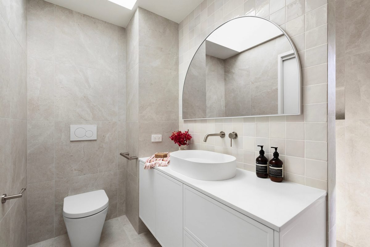 A custom designed bathroom featuring a Melange Bianco tile. Designed and built by MJ Harris Group. #MJHxWallisAve