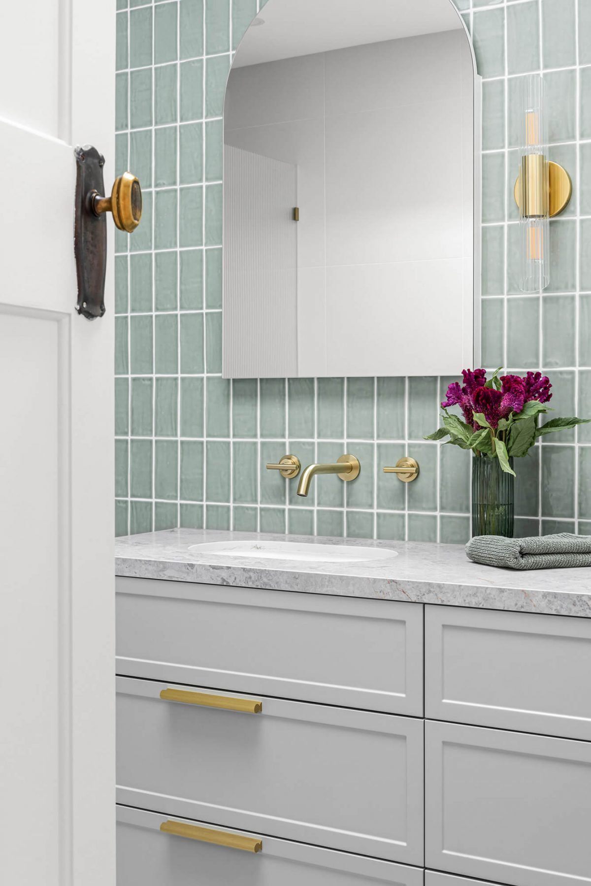 A custom designed bathroom featuring green tiles. Designed and built by MJ Harris Group. #MJHxOrrrongCt