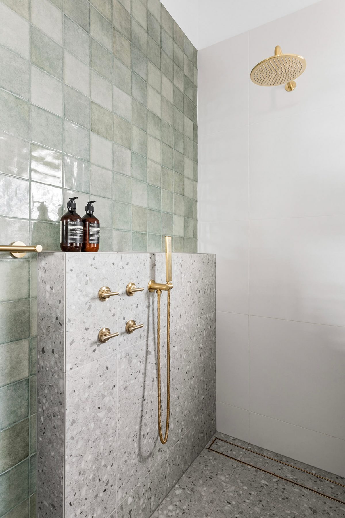 A custom designed bathroom featuring terrazzo tiles. Designed and built by MJ Harris Group. #MJHxOrrrongCt
