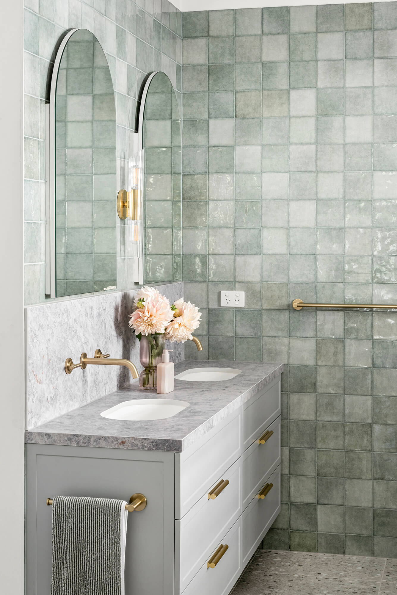 A custom designed bathroom featuring green tiles. Designed and built by MJ Harris Group. #MJHxOrrrongCt